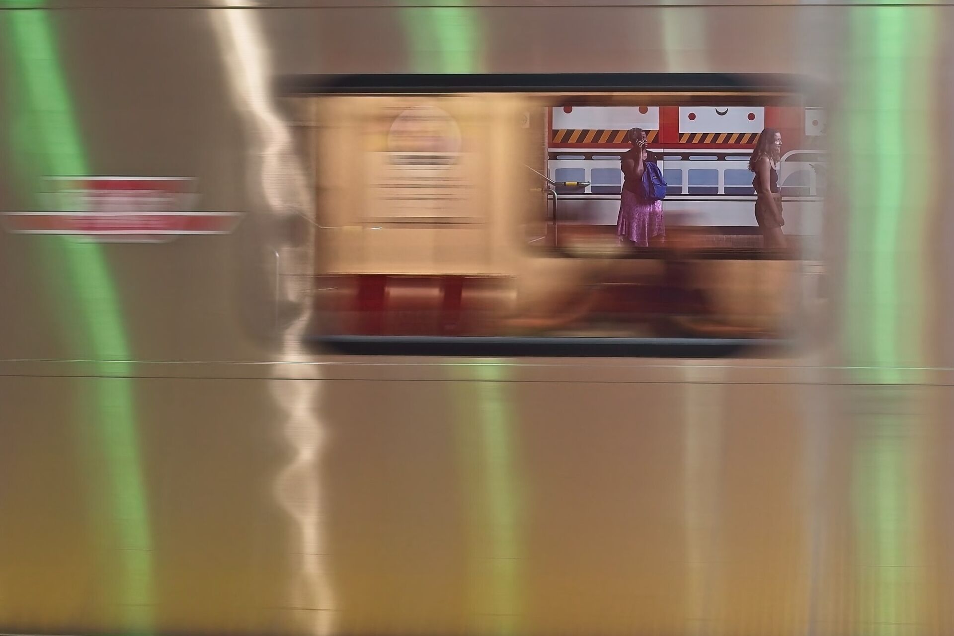 Passengers on the southbound track as a northbound train arrives
