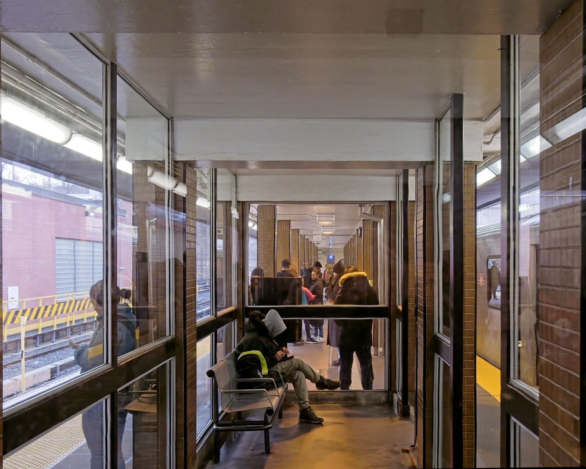 The narrow platform is further cramped by the shelters in the middle.