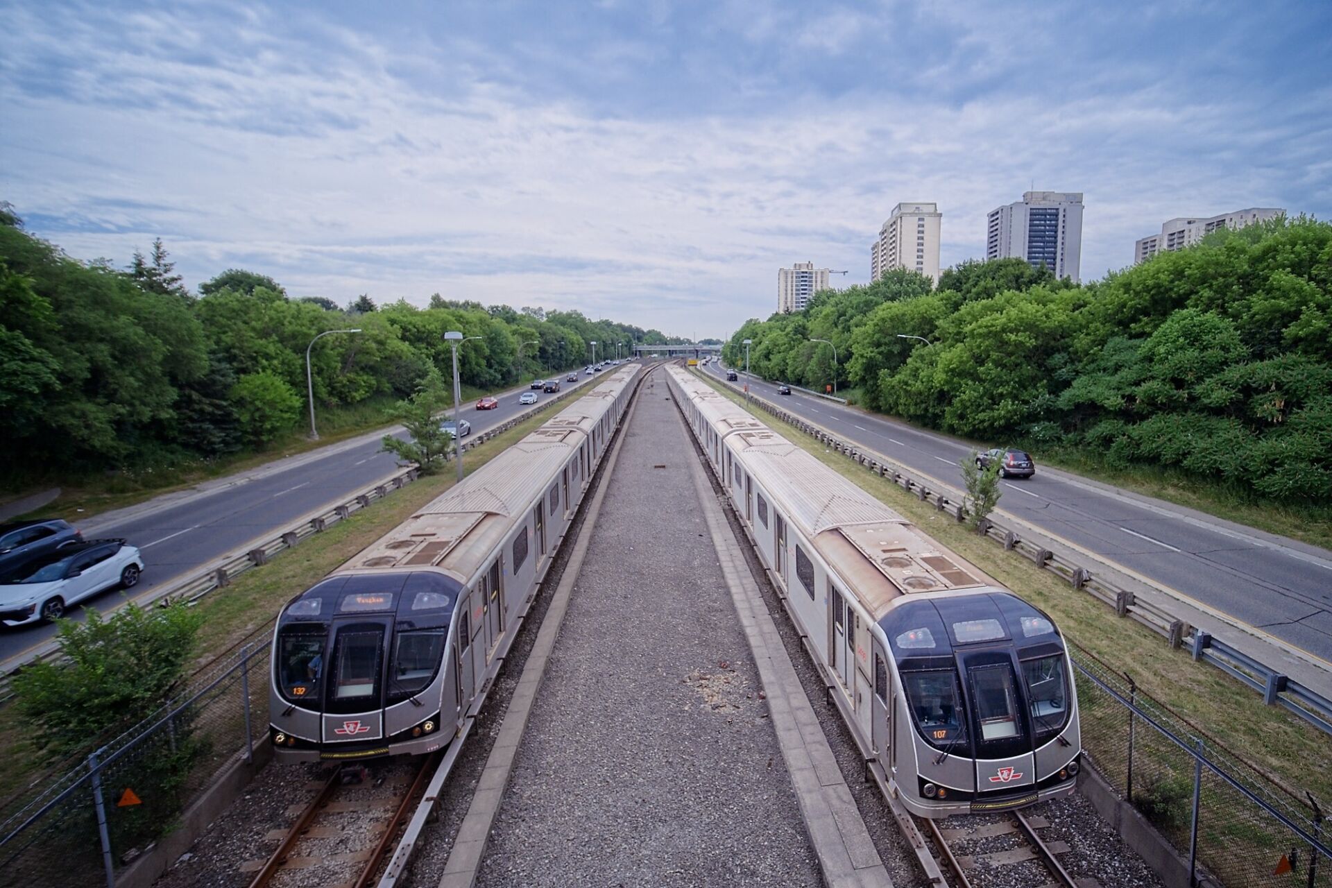 Trains arriving and departing from Glencairn station.