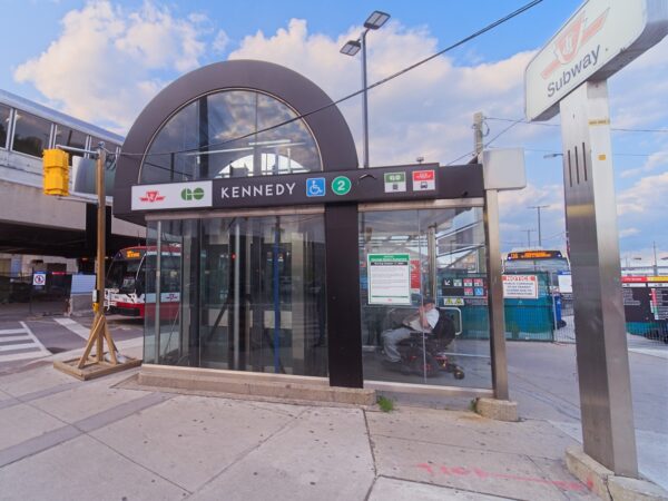 Entrance to station next to bus bay and opposite passenger pick up / drop off.