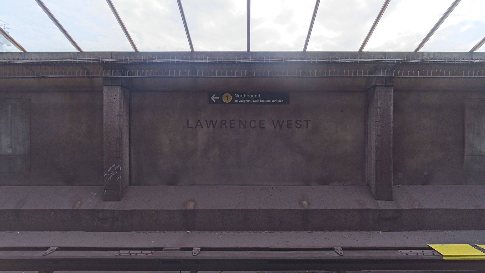 Plain concrete walls opposite the platform.