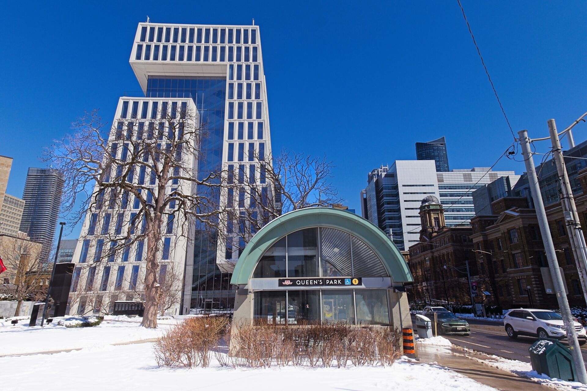 Facing west on College one of the entrances to Queen's Park station.