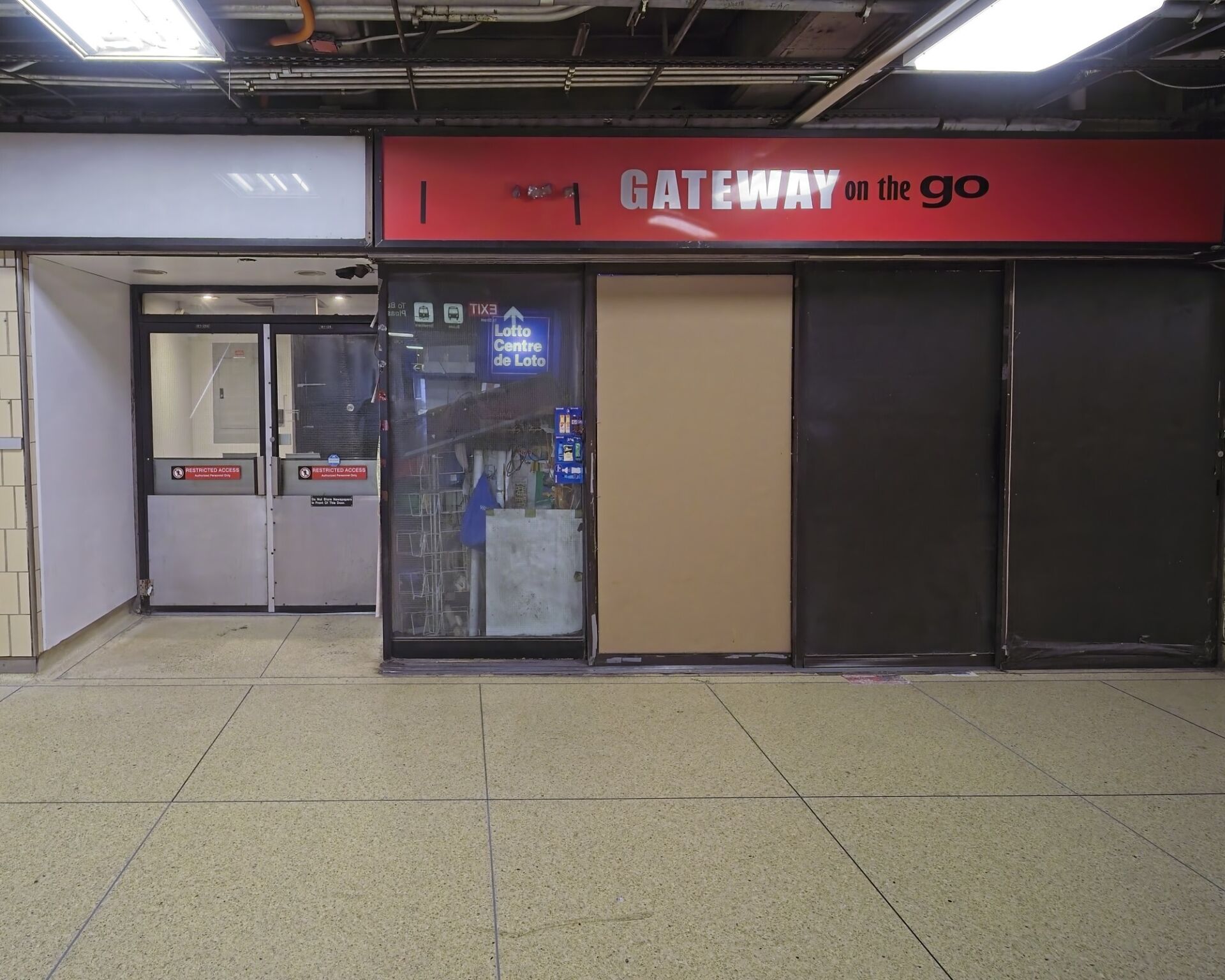 Closed convenience store next to employees only door.