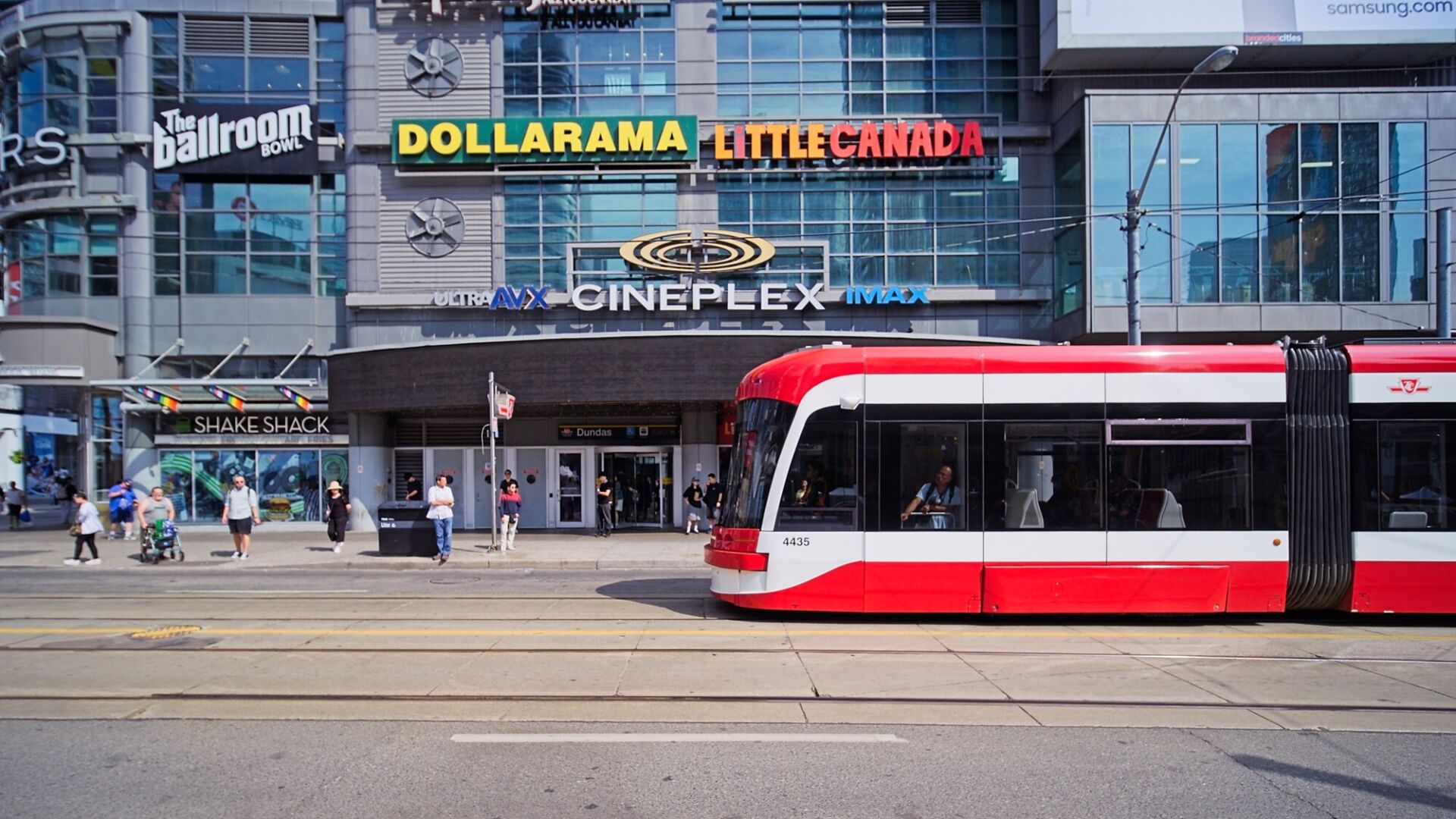 Streetcar passes by the subway entrance at Sankofa Square (formally Dundas Square).