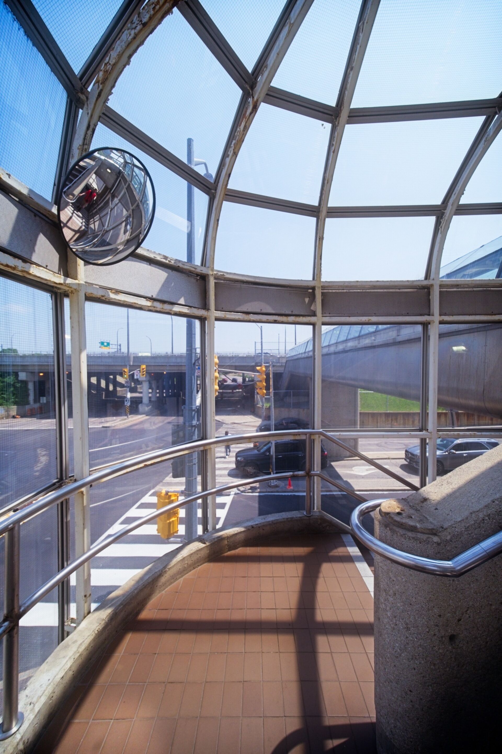 Stairs to overpass from street level.